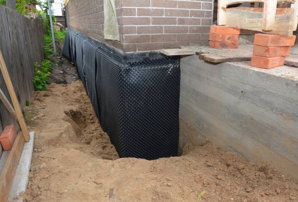 Happy homeowners after waterproofing job in Grammer